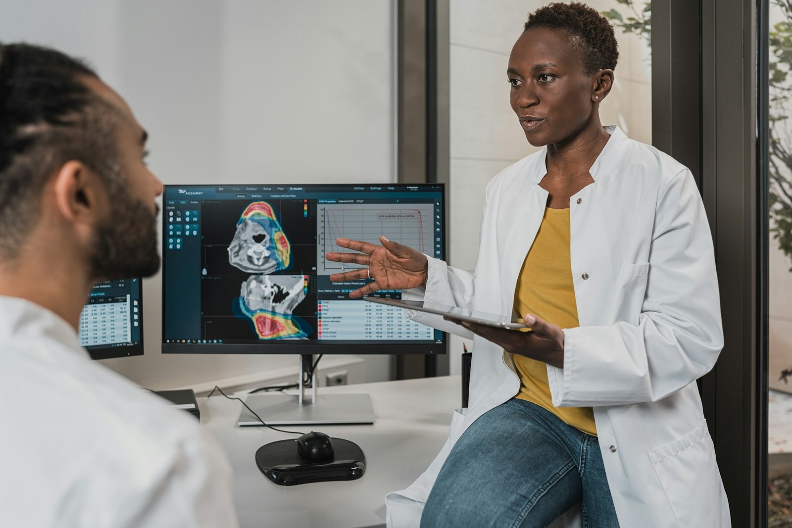 Illustrative specialist explaining results on screen